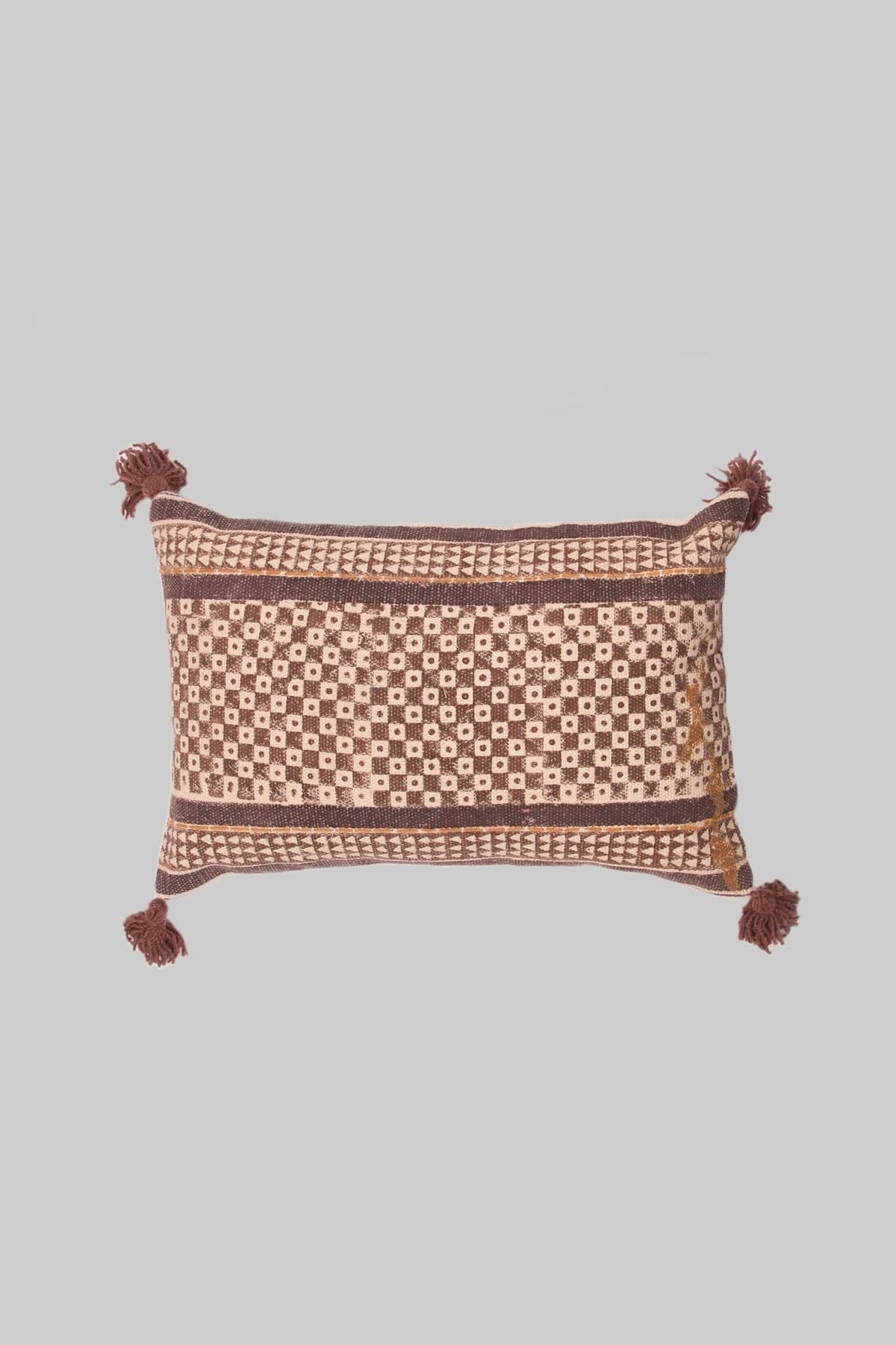 Block-printed embroidered lumbar cushion on sofa — Art Avenue