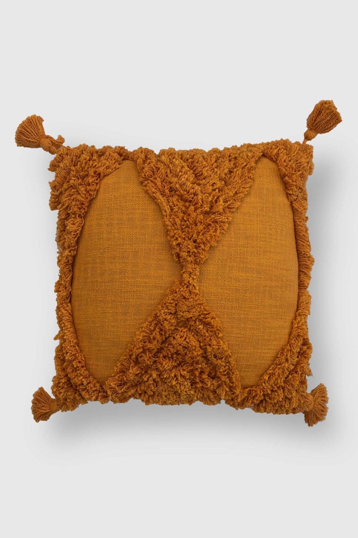 Overdyed shaggy square cushion on sofa — Art Avenue