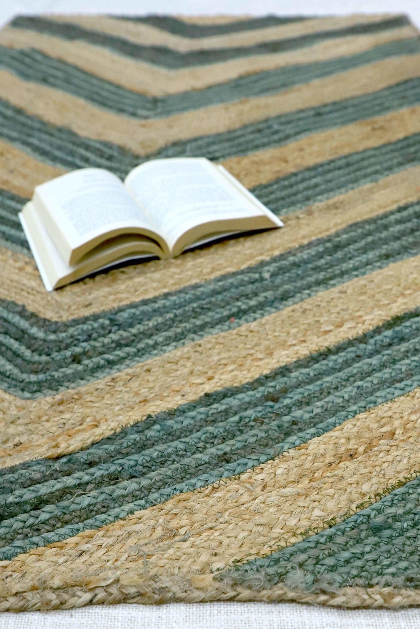 Virgo handwoven jute rug — beige and green detail — Art Avenue